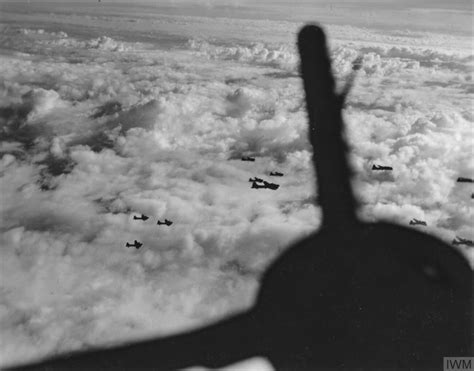 Asisbiz Boeing B-17F Fortresses 8AF 306th Bomb Group fly above the cloud cover in loose ...