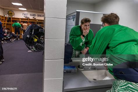 Endicott College hockey player Jack Smiley in the locker room before ...