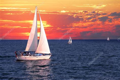 Sailboat Sailing Calm Evening Dramatic Sunset Stock Photo by ©elenathewise 4635322