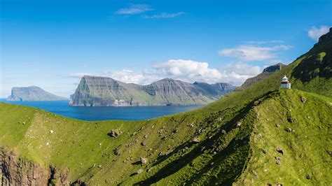 View of Kalsoy island and its lightouse at sunset, Faroe islands ...