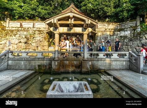 Kyoto, Japan, August 18, 2019 – Visitors at the Otowa Waterfall located ...