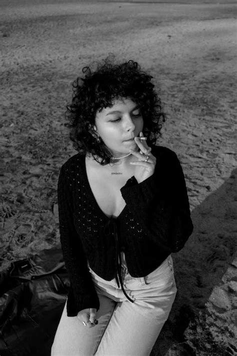 Black and White Photo of Woman Smoking Cigarette · Free Stock Photo