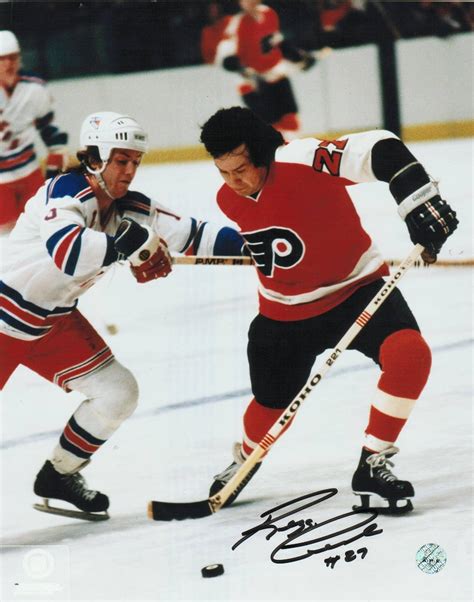 Reggie Leach Signed Photograph - 8x10 Fighting Off A Ranger