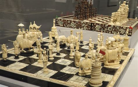 A beautiful chess set made of Indian ivory with a chessboard made of ...