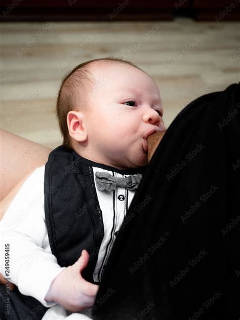 Close up of mother breast feeding her newborn baby boy at home, Happy ...