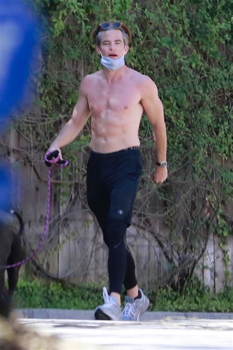 Chris Pine shows off perfect abs while walking dog