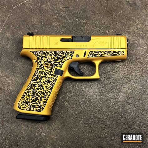 Laser Engraved Glock 43X coated in Gold | Cerakote