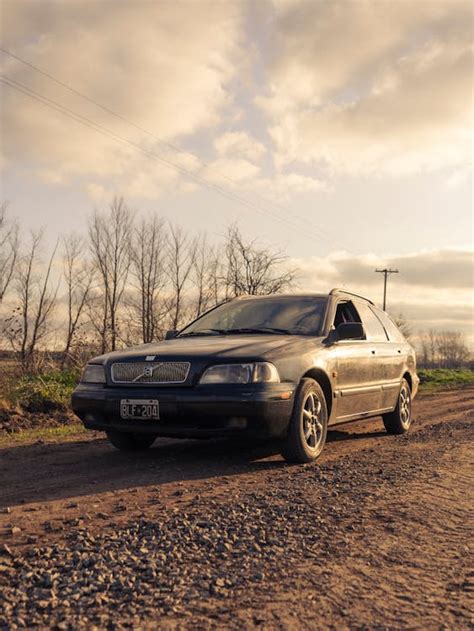 A Car on Brown Dirt Road · Free Stock Photo