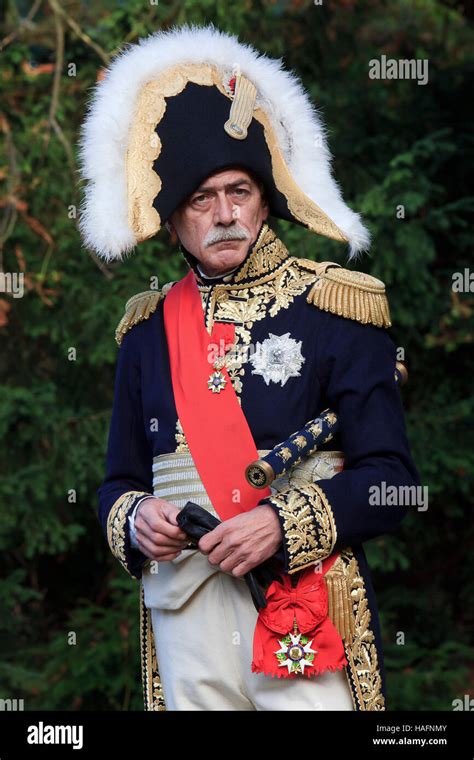 A Napoleonic Marshal of the Empire in the gardens of the Chateau de Malmaison near Paris, France ...