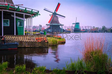 Old dutch windmills in Zaanse Schans museum village, Zaandam ...