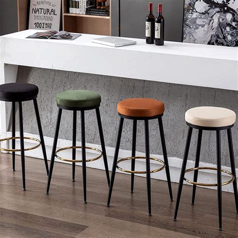 round backless bar stools upholstered velvet seats with black bases and ...