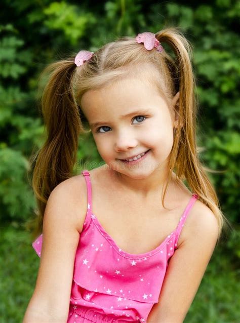 Outdoor Portrait Of Smiling Little Girl Stock Photo - Image of park, cheerful: 32502842