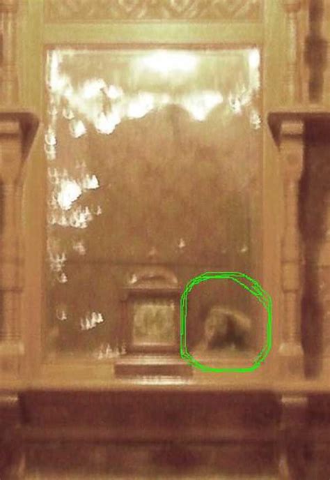 The circled anomaly is a reflection caught in the mirror at the Winchester House in CA. It was ...