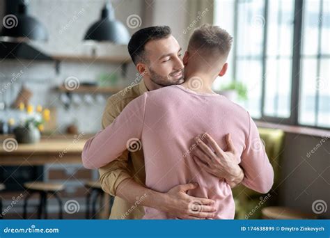 Two Young Men Standing and Hugging Each Other Stock Image - Image of millennial, relationship ...