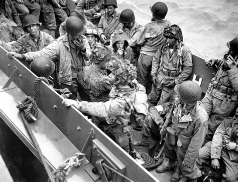 [Photo] Airborne glider pilots aboard an LCVP on their way from the Normandy beaches to a ...