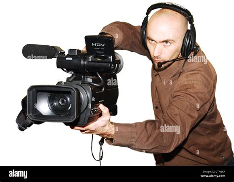 image with a television cameraman working with camera Stock Photo - Alamy