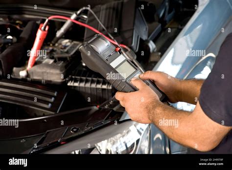 Vehicle battery installation Stock Photo - Alamy