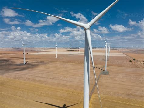 Image of Aerial view of wind turbines scattered over rural farmland ...