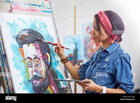 Female artist painting in art studio Stock Photo - Alamy