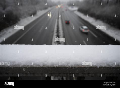 08 March 2023, Hesse, Gießen: Snow lies on a railing above the A485. An official warning of ...