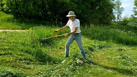 Mowing on a Slope with a Scythe - YouTube