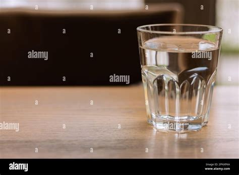 Glass of water on table. Clear water. Thirst concept. Purity background ...