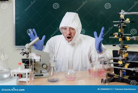 A Scientist in a Chemical Laboratory is Disappointed by a Failed Experiment with Chemicals Stock ...