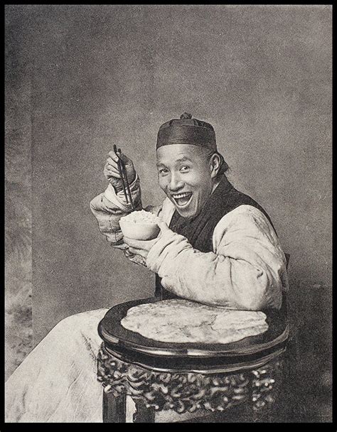 A smiling man eating rice in a photographer's studio | Historical ...