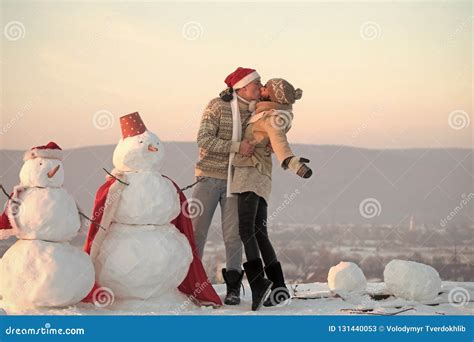 Christmas Couple in Love of Man and Girl with Snowman Stock Image - Image of holidays, love ...