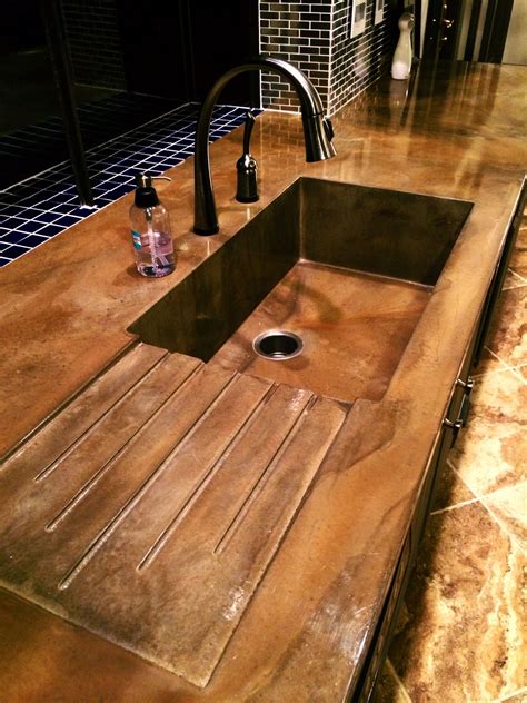 Concrete kitchen sink with drain board. Visit NuConcrete.com for all Concrete_Desig… | Concrete ...