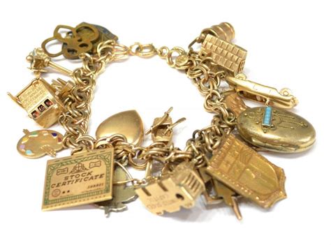 VINTAGE ESTATE 14KT GOLD CHARM BRACELET,88.8 GRAMS