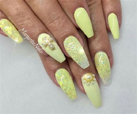 Glossy and Fancy Yellow Nails with Yellow Glitters. Glitters have been in trend since the past ...