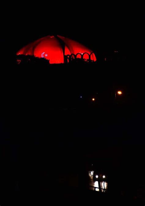 A night view of Pakistan Monument, Lit up with Pink colour to observe ...