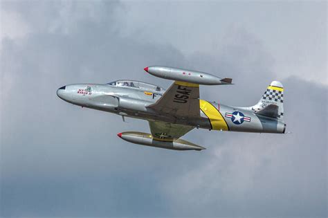 F-80 Shooting Star banking away Photograph by Bill Lindsay - Fine Art America