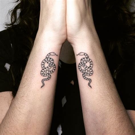 Matching snake tattoos - Tattoogrid.net