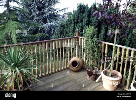 Raised Decking area with with plants in container Stock Photo - Alamy