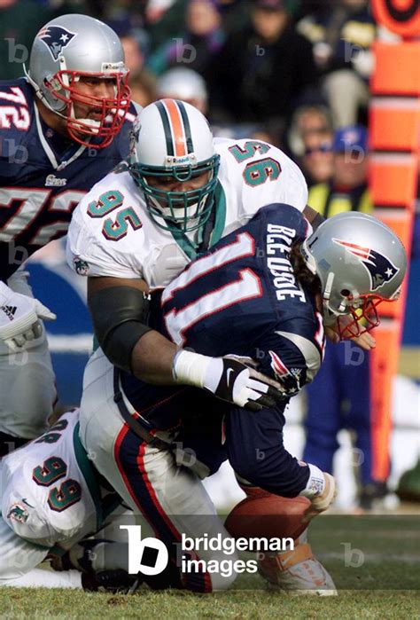 Image of PATRIOTS QUARTERBACK BLEDSOE IS SACKED BY DOLPHINS, 2000-12-24 ...