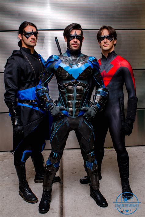 three men in costumes standing next to each other