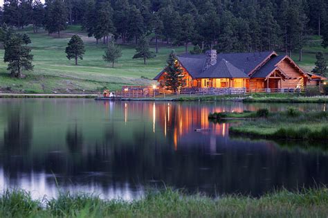 Mountain Lodge Reflecting In Lake At by Beklaus