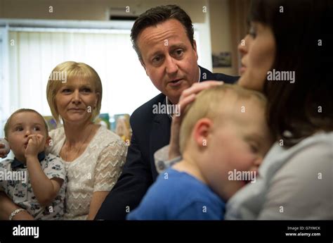 Prime Minister David Cameron meets parents with their children and ...