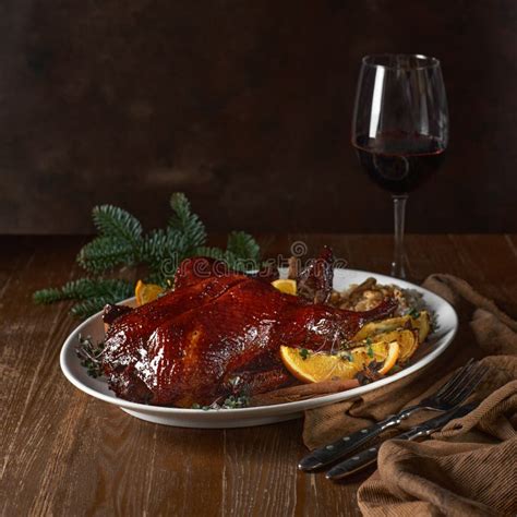 Roasted Christmas Duck with Green Tree Branch on Wooden Rustic Table ...