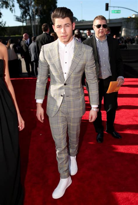 Nick Jonas looked sharp in a Versace suit with yellow plaid details and ...