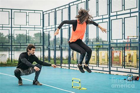 Hurdle Training With Personal Trainer Photograph by Microgen Images/science Photo Library | Fine ...