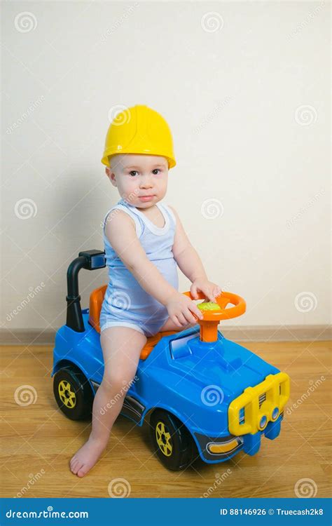 Cute Baby Boy Driving a Toy Car at Home Stock Photo - Image of ...