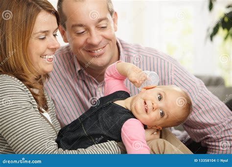 Smiling Baby With Parents Stock Images - Image: 13358104