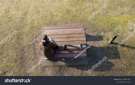 Man Sitting Alone On Bench Stock Photo 2138857205 | Shutterstock