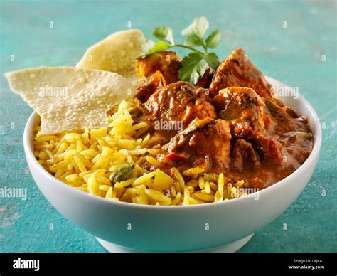 Chicken Jalfrezi, pilau rice & popodoms. Indian traditional curry Stock Photo - Alamy