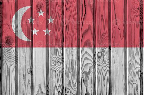 Singapore flag depicted in bright paint colors on old wooden wall ...