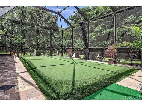 Putting green under the pool cage screen. Pine Ridge Estates in North Naples, Florida | Backyard ...