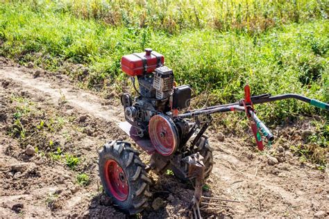 Plowing Land on a Garden Plot with a Walk-behind Tractor Stock Image - Image of mini, russia ...